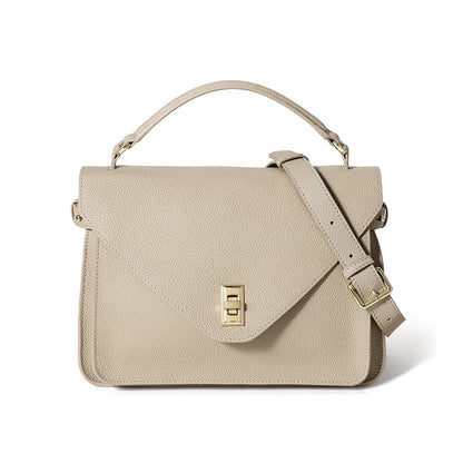 Beige handbag with a gold clasp on a white background