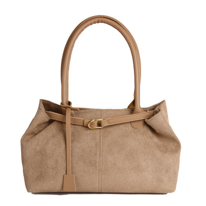 Brown handbag with a strap on a white background