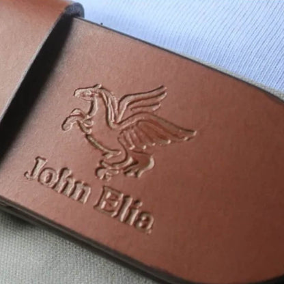 Brown leather belt with embossed logo and text on a light blue fabric background