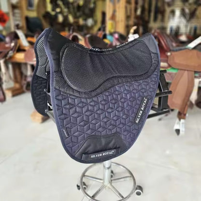 Gray saddle pad with 'Silver Royal' branding on a stool in a store setting.