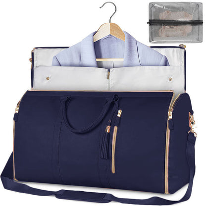Navy blue travel bag with a white garment inside, on a white background