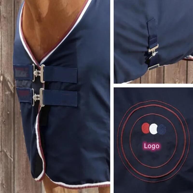 Navy blue horse blanket with logo detail on a wooden background