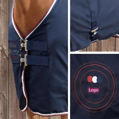 Navy blue horse blanket with logo detail on a wooden background