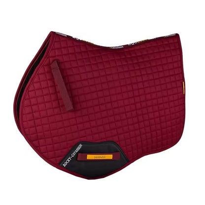 Red quilted saddle pad with black corners on a white background