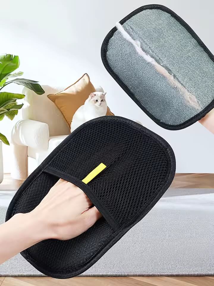 Black mesh bath slippers with a yellow label on a neutral background